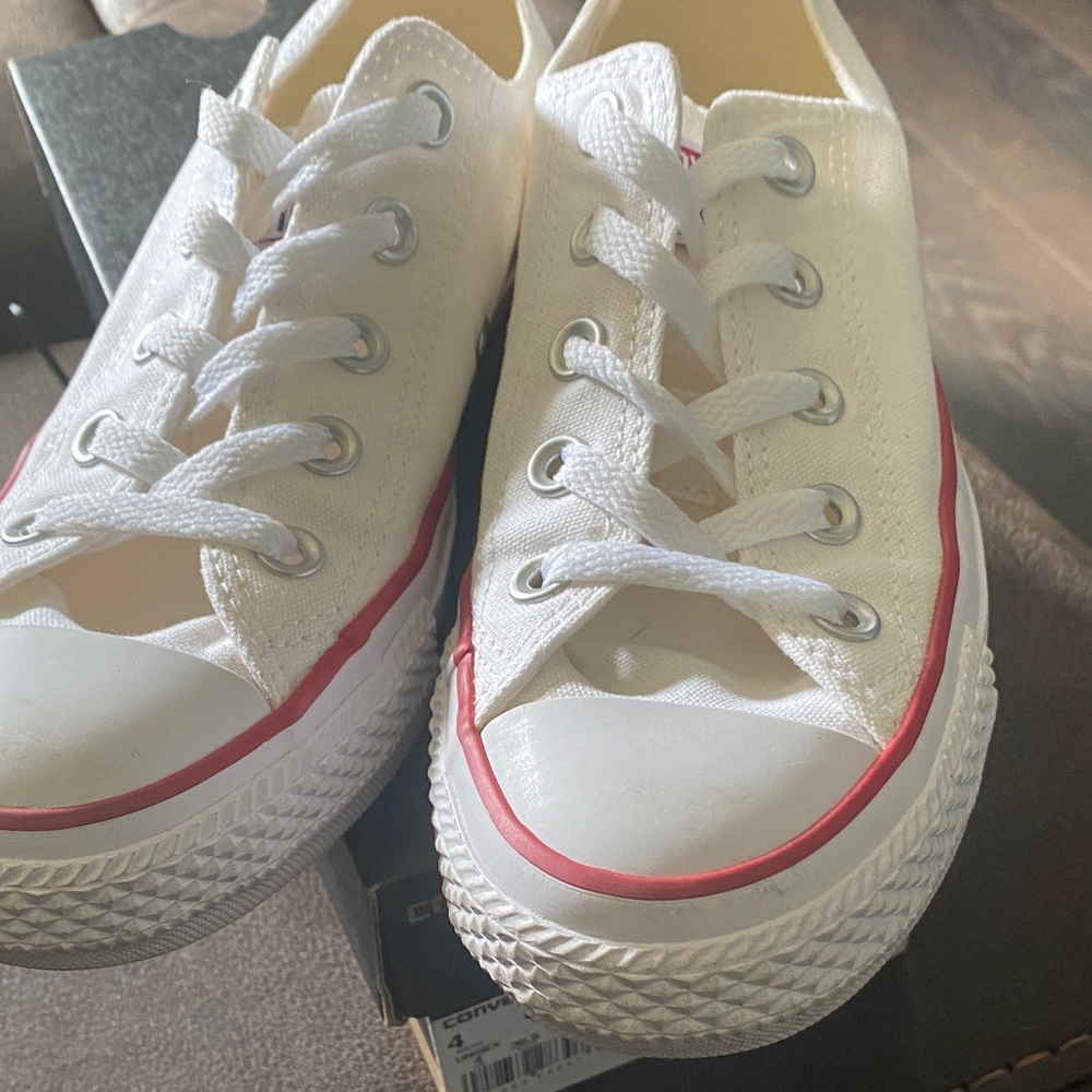 Brand new Converse Optical White Sneakers with Red Accents.